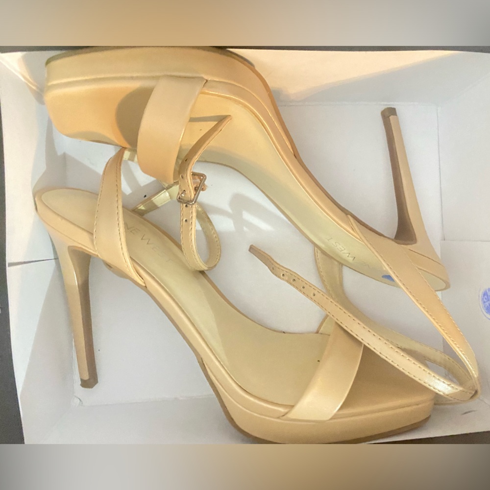 Nude Nine West heel sandals.